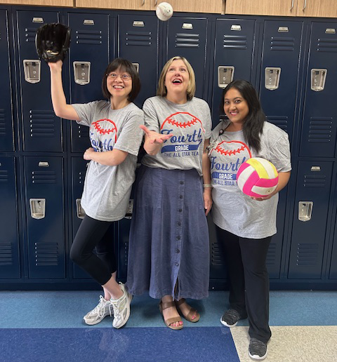 Mrs. Hu, Ms. Corrigan, and Mrs. Rahman wearing their team shirts